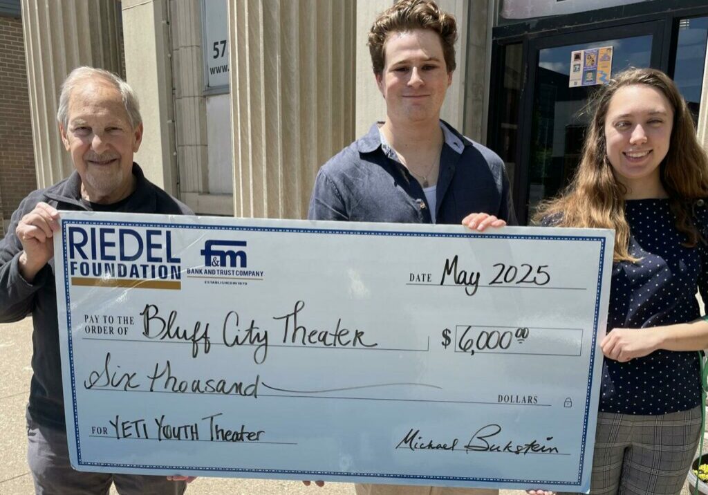 Riedel Foundation Lead Trustee Michael Bukstein presents a $6,000 grant award to Bluff City Theater for summer youth programs. Accepting the check are Artistic Director Jayme Brown and Youth Theater Director Roland Meisler.