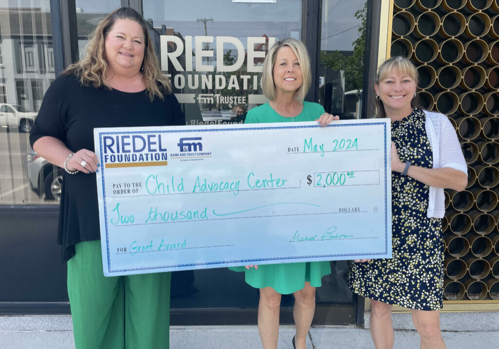 Photo caption: Riedel Trustee April Baldwin (middle) presents a check to Executive Director of The Child
Advocacy Center of Northeast Missouri, Julie Seymore and CAC Therapist Carmen Ihrig.