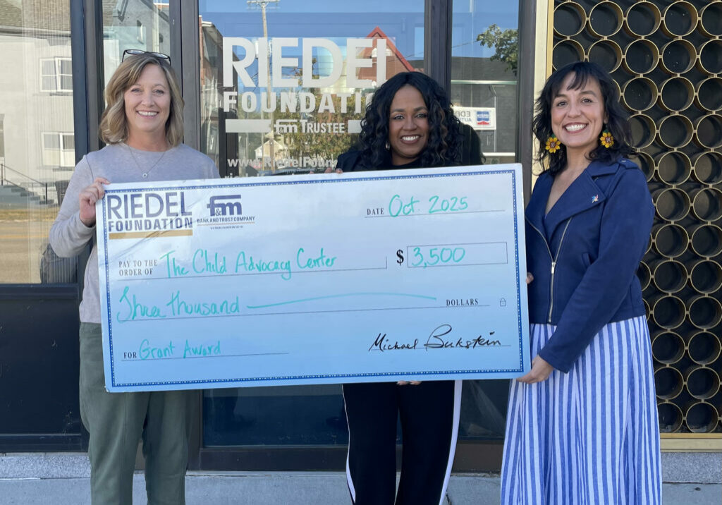 Photo caption: Riedel Foundation Administrator Sarah Deien presents a $3,500 grant to Freda Clemons, CAC Director of Finance and Business Administration and Marcella Maggio, CAC Prevention Education Specialist.