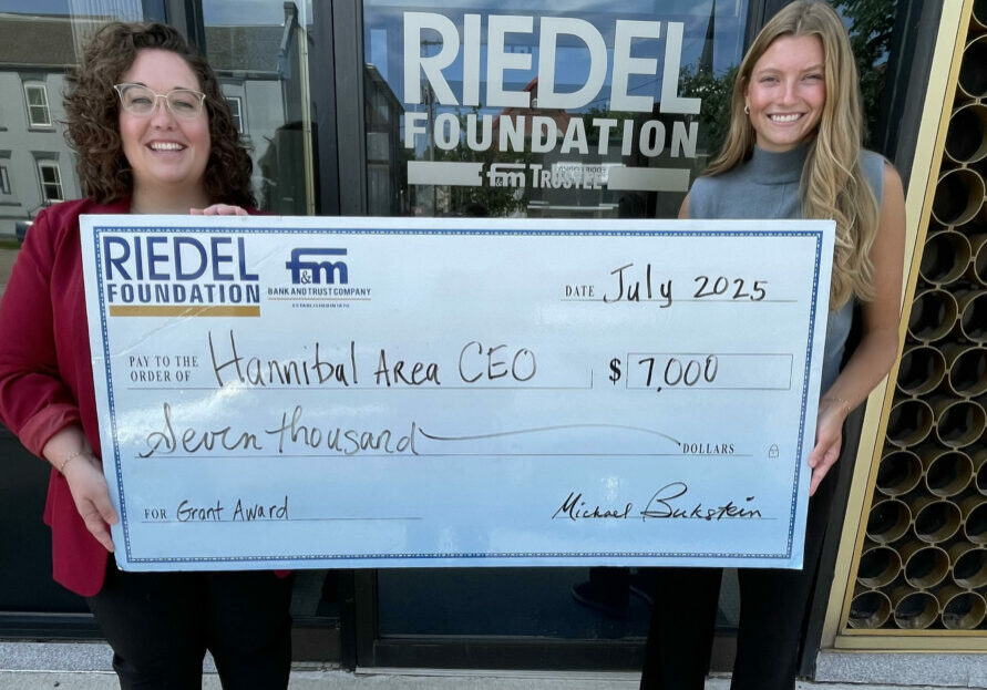 CEO Chairperson Maria Kuhns and Program Director Kendel Locke accept a $7,000 grant award from the Riedel Foundation.
