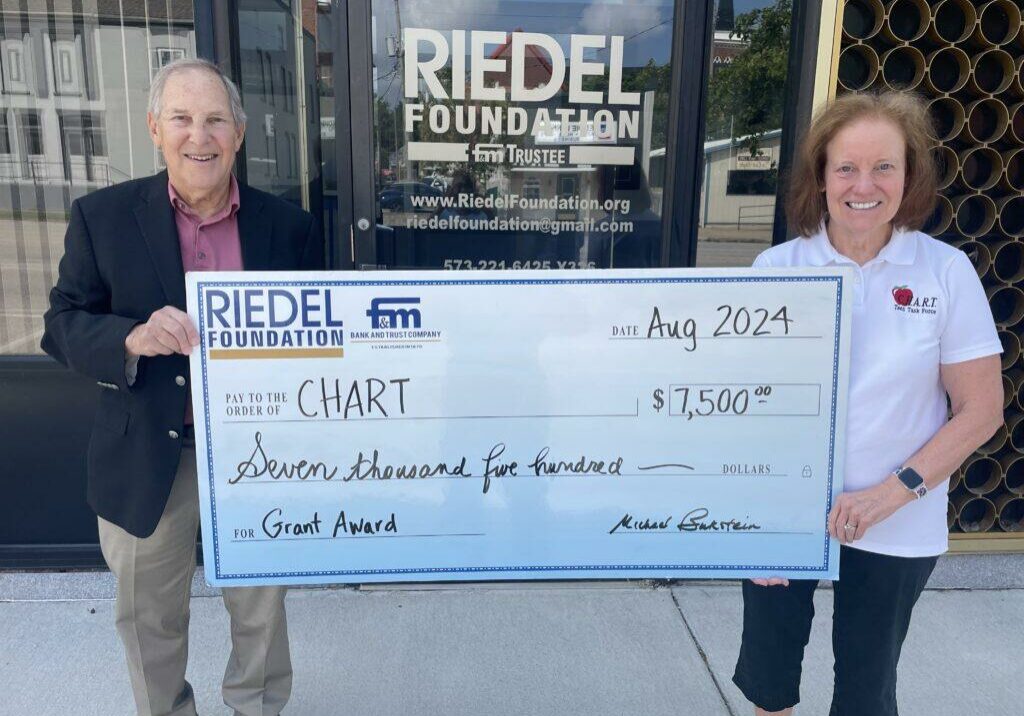 Riedel Foundation Lead Trustee Michael Bukstein presents a $7,500 grant to CHART Teen Task Force Chairperson Sandra Ahlum.        