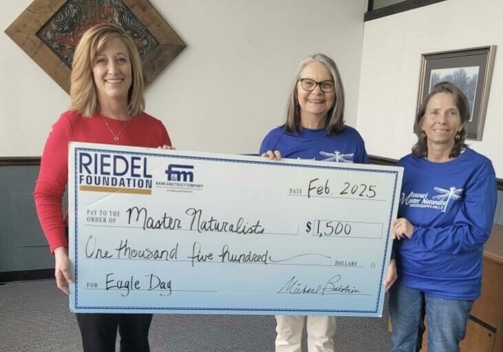 Reidel Foundation Administrator Sarah Deien presents a $1,500 grant to Master Naturalists Kristy Trevathan and Gale Rublee.