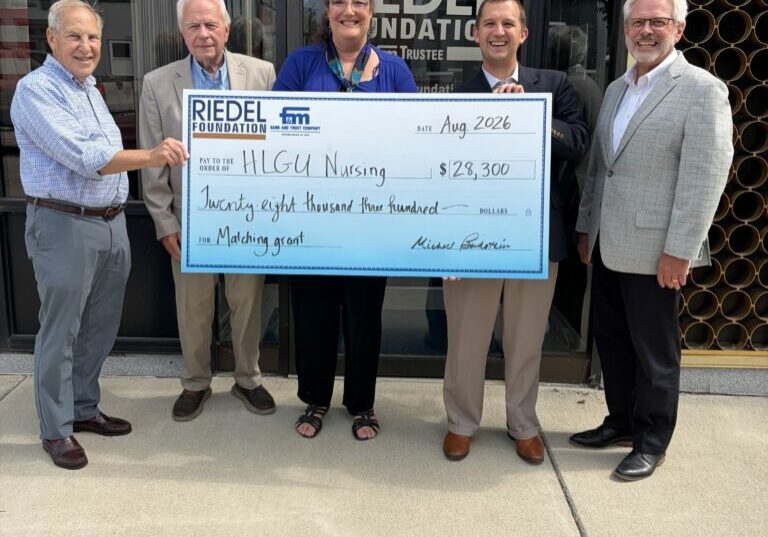 Riedel Trustees Michael Bukstein and Bill Craigmiles present a $28,300 matching grant to Dr. Ginger Wolgemuth, Director of the Craigmiles School of Nursing, HLGU President Dr. Robert Matz, and Dr. Ray Carty, VP for Institutional Advancement and Marketing at HLGU.