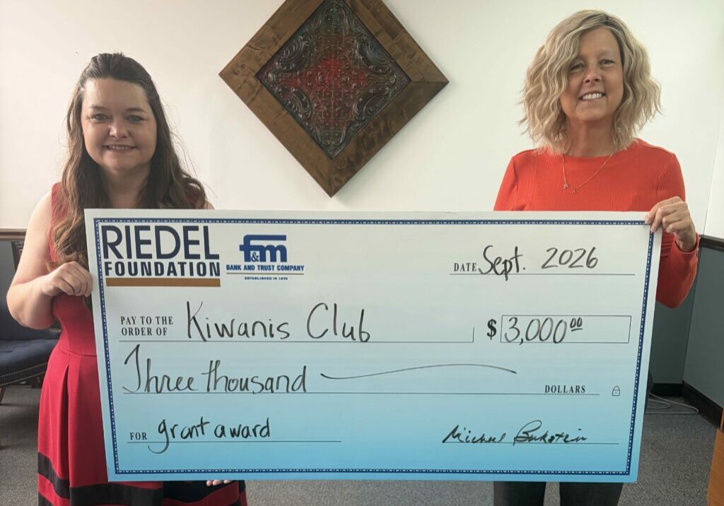 Kiwanis Club member Pam Lightle accepts a $3,000 grant award from Riedel Foundation Trustee April Baldwin.