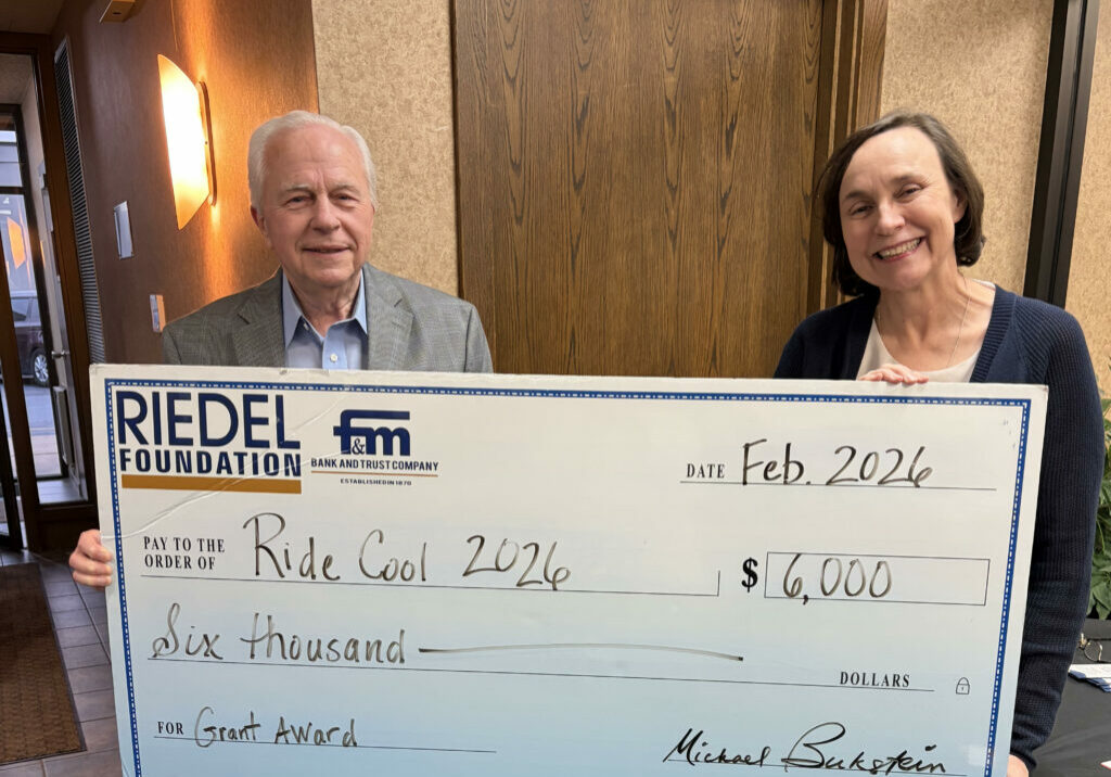 Ride Cool Chairperson Dr. Susan Meidl accepts a $6,000 grant from Riedel Foundation Trustee Bill   Craigmiles