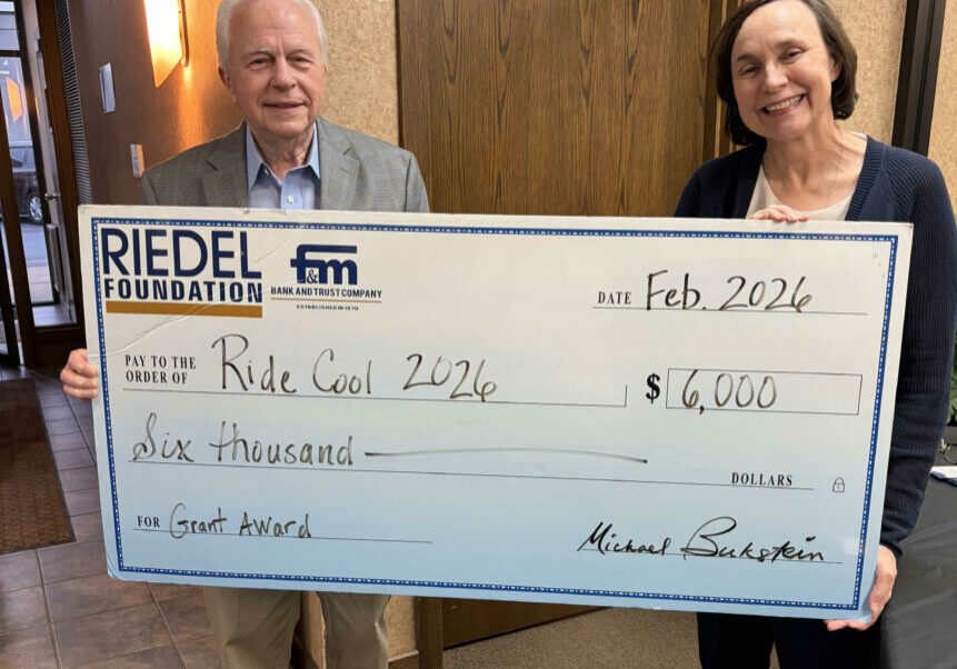 Riedel Foundation Trustee Bill Craigmiles presents a $6,000 grant to Dr. Susan Meidl, organizer of Ride Cool.