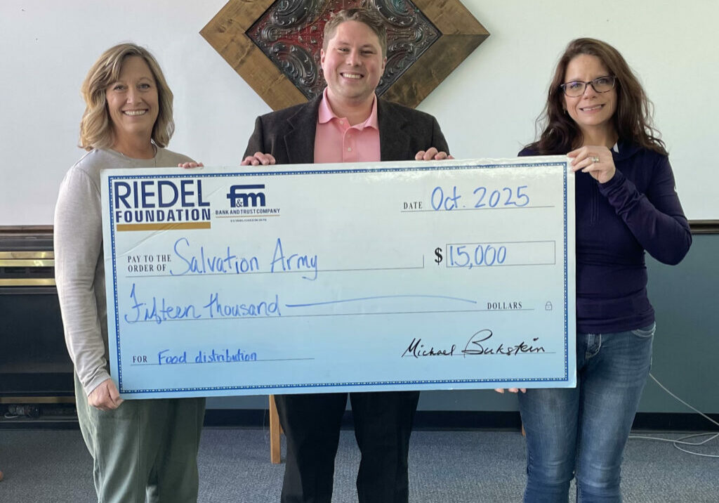 Photo caption: Riedel Foundation Administrator Sarah Deien presents a $15,000 grant award to Jake Reed, Donor Relations Coordinator and Amanda Bowen, Family Case Worker with the Salvation Army.