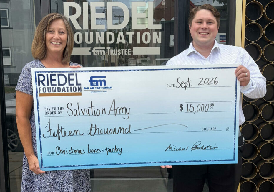 Riedel Foundation Administrator Sarah Deien presents a $15,000 grant award to Jake Reed, Donor Relations Coordinator for the Salvation Army in Hannibal.